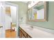 Bathroom vanity featuring a white sink, and hardwood cabinets at 6201 King Croydon Ct Ct, Raleigh, NC 27603