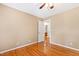 Light-filled bedroom featuring hardwood floors with easy access to bathroom at 6201 King Croydon Ct Ct, Raleigh, NC 27603