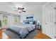 Light-filled bedroom features hardwood floors, ceiling fan and an area rug at 6201 King Croydon Ct Ct, Raleigh, NC 27603