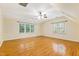 Spacious bedroom with lots of light, hardwood floors and ceiling fan at 6201 King Croydon Ct Ct, Raleigh, NC 27603