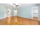 Spacious bedroom featuring hardwood floors, mint walls and access to bath at 6201 King Croydon Ct Ct, Raleigh, NC 27603