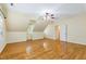 Large bedroom with hardwood floors, slanted ceilings, and ceiling fan at 6201 King Croydon Ct Ct, Raleigh, NC 27603