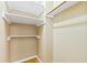 Walk in closet with painted shelving and hardwood floors at 6201 King Croydon Ct Ct, Raleigh, NC 27603