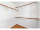 Walk-in closet with hardwood floors and white walls at 6201 King Croydon Ct Ct, Raleigh, NC 27603