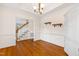 Dining room with hardwood floors, crown molding, and a chandelier at 6201 King Croydon Ct Ct, Raleigh, NC 27603