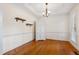 Dining room with hardwood floors, crown molding, and a built-in cabinet at 6201 King Croydon Ct Ct, Raleigh, NC 27603