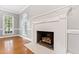 Close up of a fireplace with a decorative mantel and brick surround at 6201 King Croydon Ct Ct, Raleigh, NC 27603