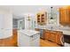 Spacious kitchen with granite island, stainless steel appliances, and ample cabinet space at 6201 King Croydon Ct Ct, Raleigh, NC 27603