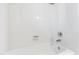 Clean bathroom tub with white tile surround, soap dish and modern chrome fixture at 6201 King Croydon Ct Ct, Raleigh, NC 27603