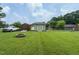 Expansive backyard with grass, storage sheds and fire pit, perfect for outdoor enjoyment at 635 Raymond Dr, Wendell, NC 27591