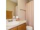 Cozy bathroom featuring vanity with framed mirror and a shower with neutral wall paint at 635 Raymond Dr, Wendell, NC 27591