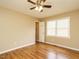 Well-lit bedroom featuring ceiling fan and laminate wood flooring at 635 Raymond Dr, Wendell, NC 27591