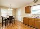 Dining area with laminate countertops, cabinetry, and sink, illuminated by natural light at 635 Raymond Dr, Wendell, NC 27591