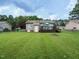 Charming home featuring a backyard with grass, firepit, and a cozy deck at 635 Raymond Dr, Wendell, NC 27591