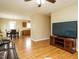 Open living room with hardwood floors and a clear view into kitchen and dining areas at 635 Raymond Dr, Wendell, NC 27591