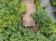 Aerial view of rooftops surrounded by lush green trees at 6422 English Oaks Dr, Raleigh, NC 27615