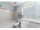 Bright bathroom featuring a shower-tub combo, a vanity with a faux marble top, and a medicine cabinet at 6422 English Oaks Dr, Raleigh, NC 27615