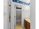 Charming bathroom featuring blue sun and star-themed wallpaper and a standard shower-tub combo at 6422 English Oaks Dr, Raleigh, NC 27615