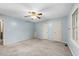 Airy bedroom with neutral walls and carpet, well-lit by natural light from the window at 6422 English Oaks Dr, Raleigh, NC 27615