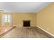 Spacious living room with wood flooring and a fireplace as the focal point at 6422 English Oaks Dr, Raleigh, NC 27615