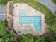 Aerial view of a community pool with lounge chairs and umbrellas at 6422 English Oaks Dr, Raleigh, NC 27615