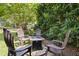 Backyard patio setting features a seating area with chairs around a fire pit at 6608 Quiet Cove Ct, Raleigh, NC 27612
