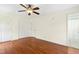 Large bedroom with wood floors, ceiling fan, two large closets and an en-suite bathroom at 6608 Quiet Cove Ct, Raleigh, NC 27612