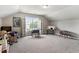 Large bonus room featuring built-in shelves and ample space at 6901 Rex Rd, Holly Springs, NC 27540