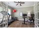 Bright room with a ceiling fan, and natural light, perfect for a home office or flex space at 6901 Rex Rd, Holly Springs, NC 27540
