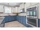 Well-equipped kitchen with stainless steel appliances, ample counter space, and stylish cabinetry at 6901 Rex Rd, Holly Springs, NC 27540