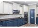 Updated kitchen featuring stainless steel appliances, and stylish fixtures at 6901 Rex Rd, Holly Springs, NC 27540