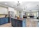 Spacious kitchen offering a view of the living area, ideal for modern living and entertaining at 6901 Rex Rd, Holly Springs, NC 27540
