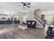 Open floor plan showcasing the seamless flow from the living room to the kitchen and staircase at 6901 Rex Rd, Holly Springs, NC 27540