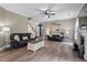 Cozy living room with wood floors, comfortable seating, and a fireplace adding warmth to the space at 6901 Rex Rd, Holly Springs, NC 27540