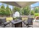 Screened patio with comfortable seating and a view of the backyard at 6901 Rex Rd, Holly Springs, NC 27540