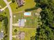 Aerial view of a beautiful home with a swimming pool in a spacious, well-maintained yard at 6965 Ogburn Farms Dr, Willow Springs, NC 27592
