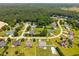 Aerial view of a residential neighborhood with tree-lined streets and well-maintained yards at 6965 Ogburn Farms Dr, Willow Springs, NC 27592