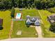 Lovely aerial view showcases home with large, fenced yard, lush landscaping, and sparkling pool at 6965 Ogburn Farms Dr, Willow Springs, NC 27592