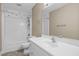 Bathroom featuring a shower-tub combo, white vanity, and updated fixtures at 6965 Ogburn Farms Dr, Willow Springs, NC 27592