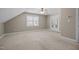 Neutral bedroom featuring double-door closet, large window, and ceiling fan at 6965 Ogburn Farms Dr, Willow Springs, NC 27592