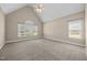 Spacious bedroom featuring vaulted ceiling and large windows offering plenty of natural light at 6965 Ogburn Farms Dr, Willow Springs, NC 27592