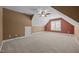Large bonus room with angled ceilings, neutral carpet, fresh paint, and natural light at 6965 Ogburn Farms Dr, Willow Springs, NC 27592