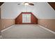 Bonus room with neutral carpet, fresh paint, and natural light from a window at 6965 Ogburn Farms Dr, Willow Springs, NC 27592