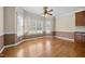 Dining room area featuring hardwood floors, large windows and neutral paint at 6965 Ogburn Farms Dr, Willow Springs, NC 27592