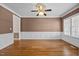 Formal dining room with hardwood floors, crown molding, and large windows offering ample natural light at 6965 Ogburn Farms Dr, Willow Springs, NC 27592