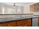 Close up on kitchen sink with stainless steel appliances and a tile backsplash at 6965 Ogburn Farms Dr, Willow Springs, NC 27592