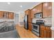 Well-equipped kitchen with stainless steel appliances, granite countertops, and ample cabinet space at 6965 Ogburn Farms Dr, Willow Springs, NC 27592