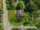 Overhead aerial of home on grassy lot, showcasing the detached garage and street access at 703 Whitsett Ave, Gibsonville, NC 27249