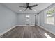 This bedroom has an ensuite bathroom, hardwood flooring, and natural light at 703 Whitsett Ave, Gibsonville, NC 27249