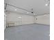 Spacious and clean two-car garage with sealed concrete floors and ample lighting, ready for use at 703 Whitsett Ave, Gibsonville, NC 27249
